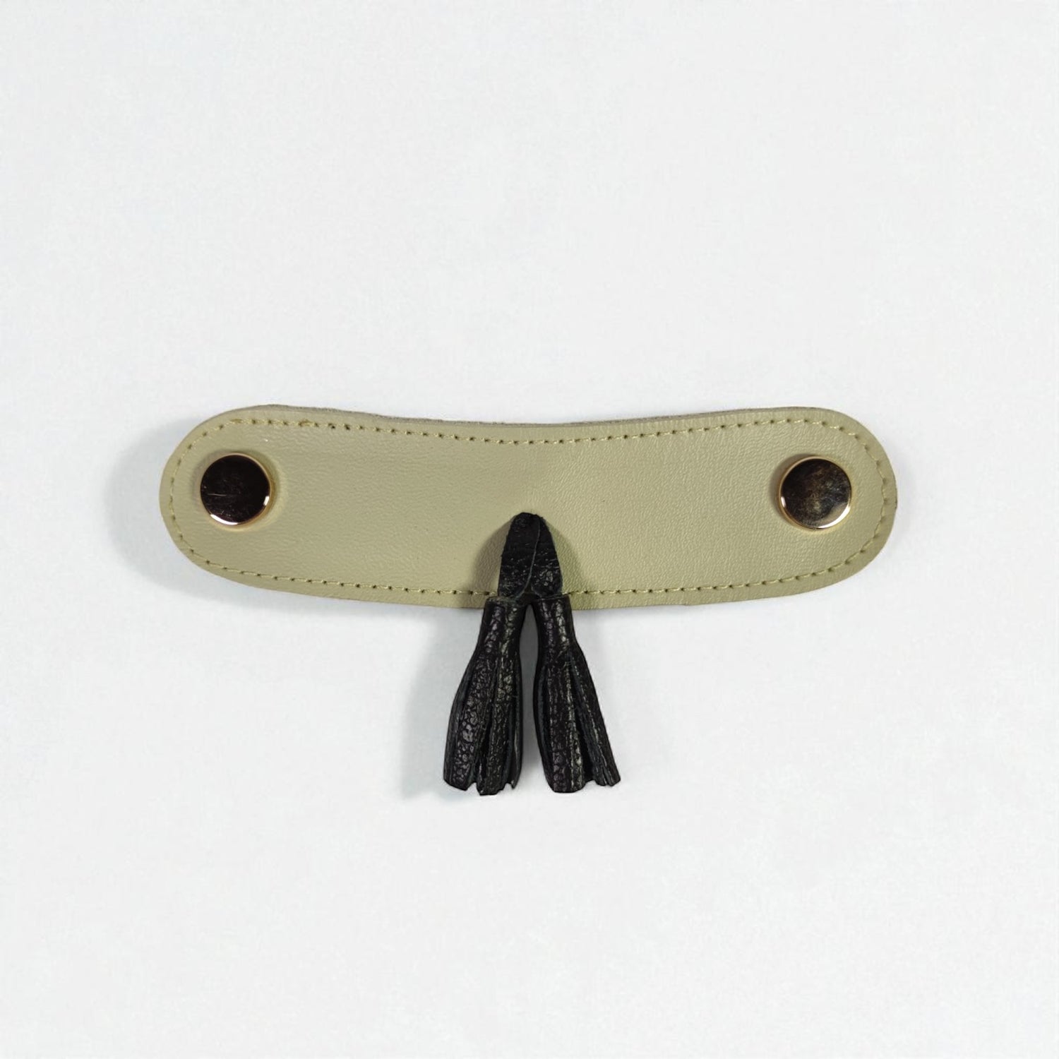 Detalle Borlas cuero